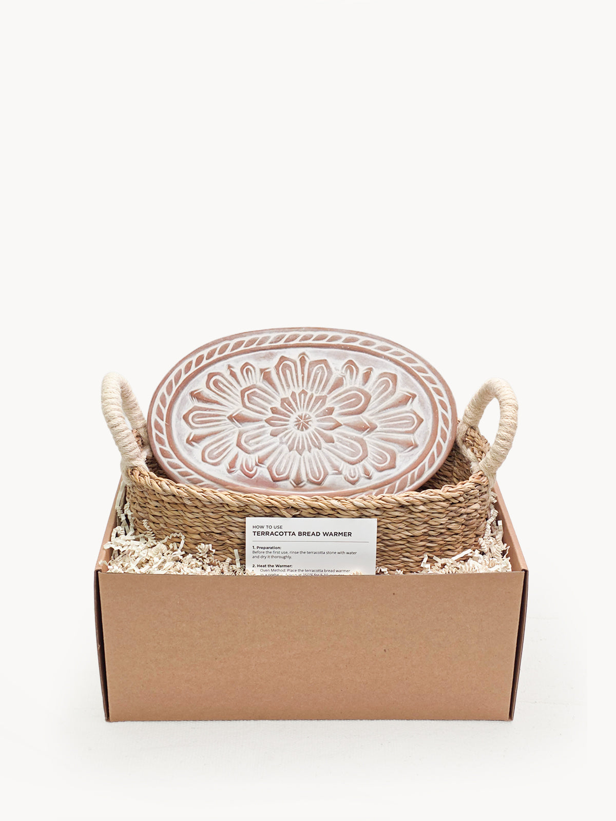 Ceramic plate with floral design in a woven basket on a white background
